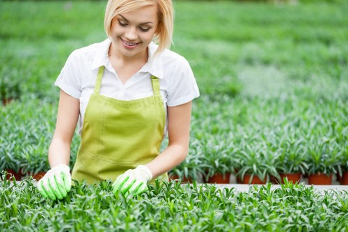 Gardener restoring a flowerbed to illustrate remediation outcome